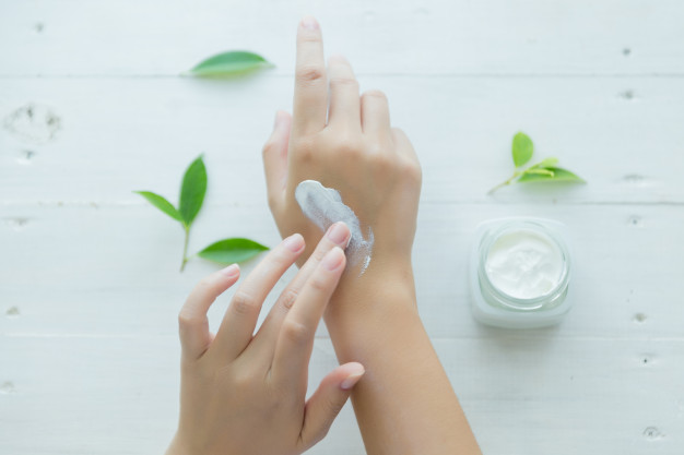 woman-holds-jar-with-cosmetic-cream-her-hands